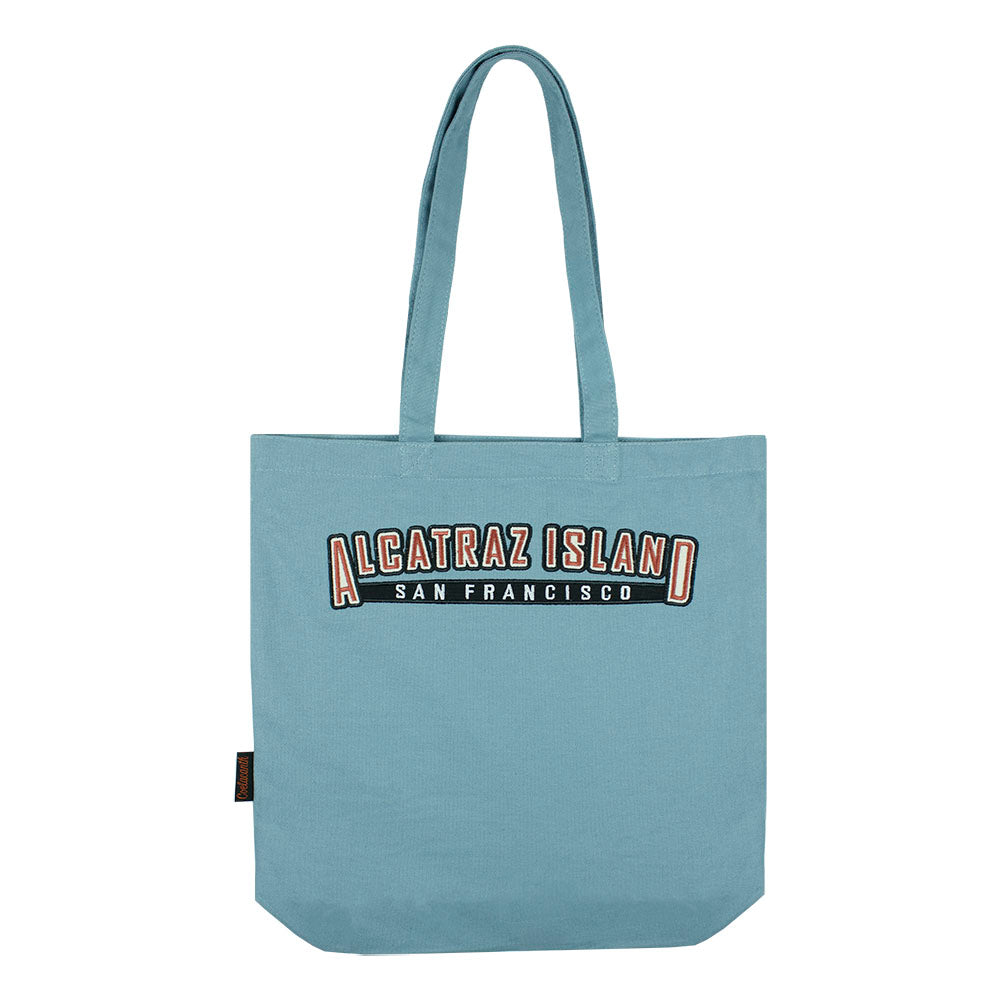 Light blue tote bag with embroidered 'Alcatraz Island San Francisco' text 