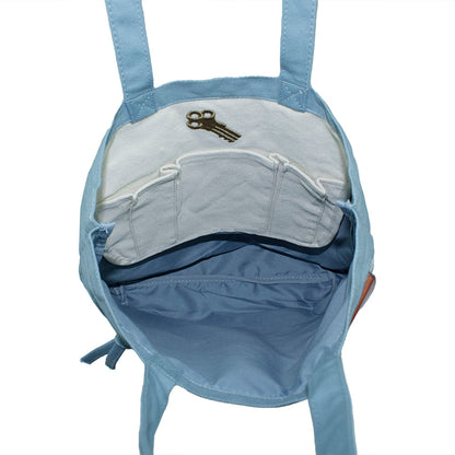 Interior of blue tote bag with an embroidered design of Alcatraz prison key