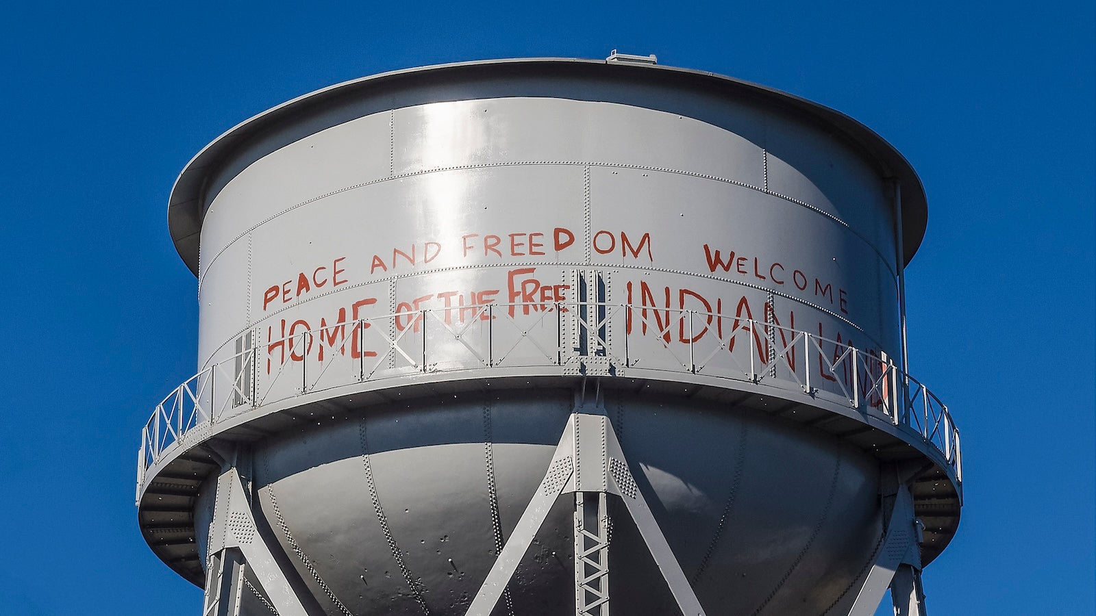 Alcatraz water tower with political slogans from the Indians of All Tribes Occupation, reading Peace and Freedom Welcome