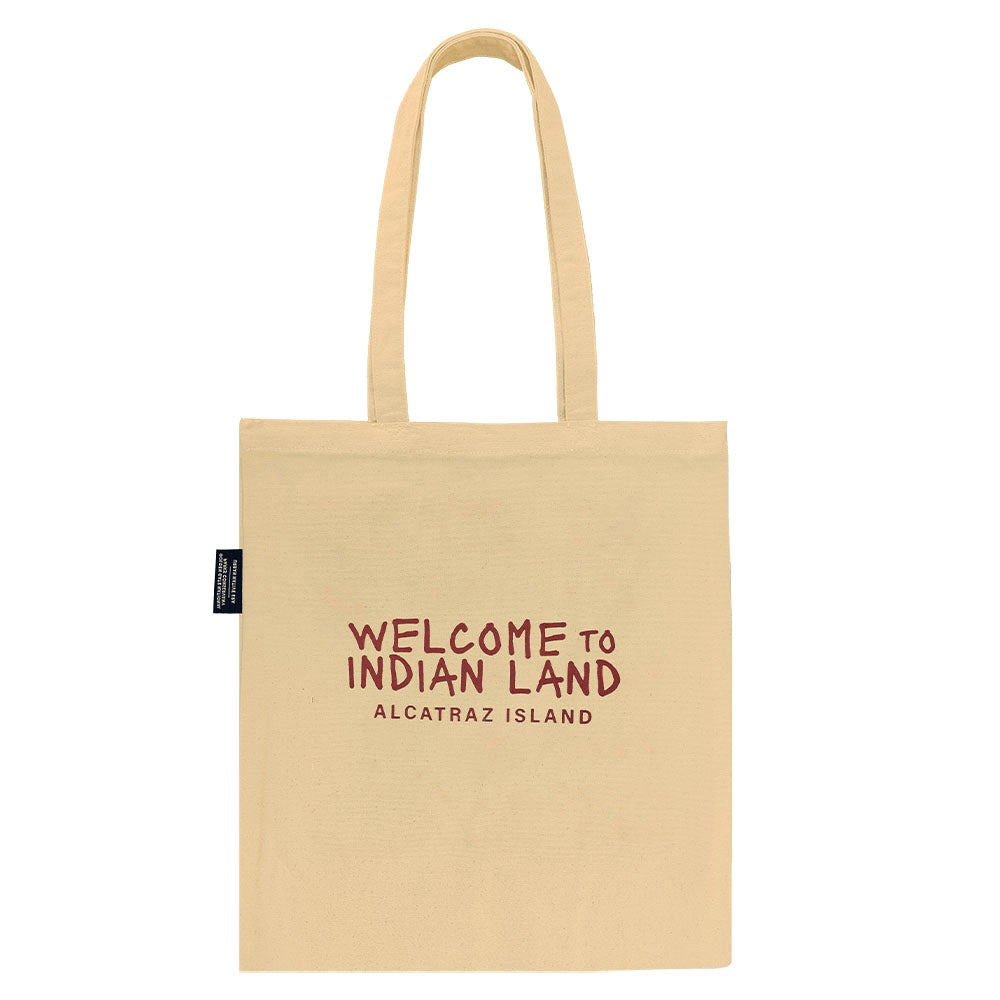 Beige tote bag with red text and Alcatraz Occupation political statements on a white background