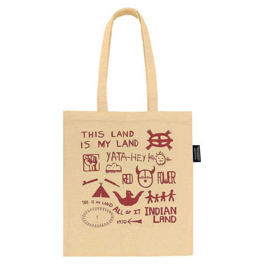 Beige tote bag with red text and Alcatraz Occupation political statements on a white background