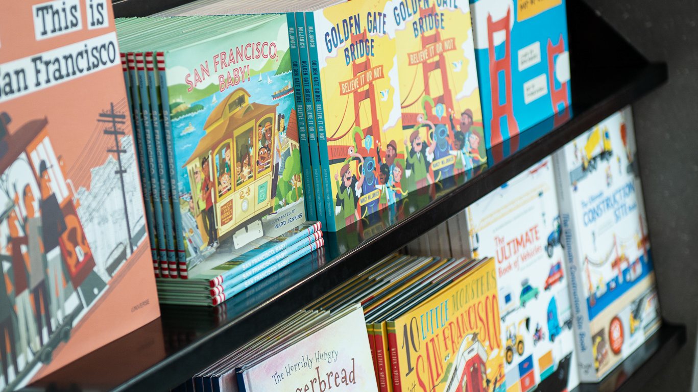Collection of childrens' books on a shelf at the Golden Gate Bridge Welcome Center