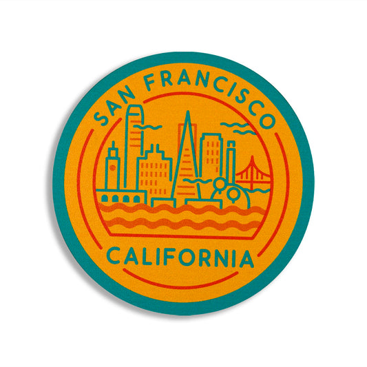 Round coaster with San Francisco, California text and cityscape illustration on a yellow background