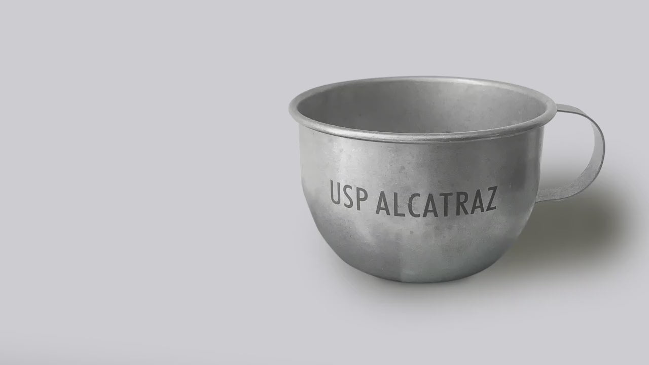 Load video: Video about Alcatraz replica inmate cup by Golden Gate National Parks Conservancy